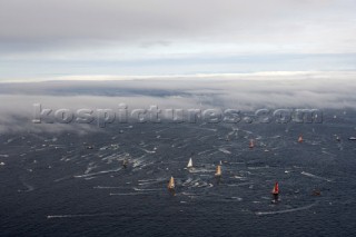 ST. MALO, FRANCE - OCTOBER 29th 2006: The Open 60 trimarans and monohull classes are watched by crowds of spectators as they start the Route du Rhum trans-atlantic race off St. Malo, France, on October 29th. The Route du Rhum is a challenging race for solo sailors which starts in St Malo and finishes in Pointe a Pitre, Guadeloupe. (Photo by Gilles Martin-Raget/Kos Picture Source via Getty Images)