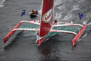 ST. MALO, FRANCE - OCTOBER 29th 2006: Thomas Colville (Fra) on his trimaran Sodebo starts the Route du Rhum. The Open 60 trimarans and monohull classes are watched by crowds of spectators as they start the Route du Rhum trans-atlantic race off St. Malo, France, on October 29th. The Route du Rhum is a challenging race for solo sailors which starts in St Malo and finishes in Pointe a Pitre, Guadeloupe. (Photo by Gilles Martin-Raget/Kos Picture Source via Getty Images)