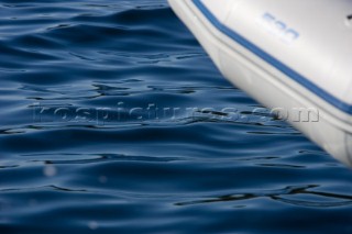 Edge of RIB sitting above ripples of water