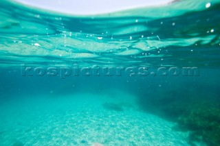 Looking at the seabed and waterline from under water