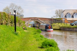 Narrow Boat on the Llangollen Canal passing  the junction with the Montgomery Canal,Frankton Junction,Welsh Frankton,Shropshire,England,UK.April 2006.