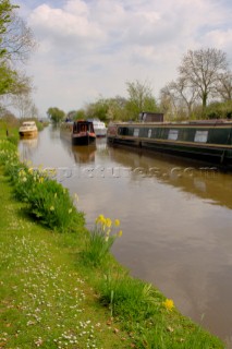 Narrow boat passing moorings on Llangollen canal near Frankton Junction,Welsh Frankton,Shropshire,England,UK.