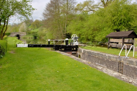 Belan locksMontgomery canal with bridge 121 in the background near WelshpoolPowysWalesUKMay 2006