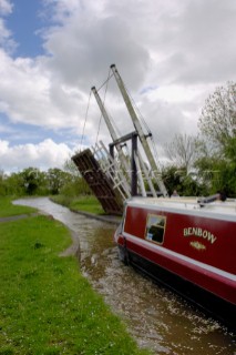 Narrow boat approaching Allmans lift bridge No.1,Prees branch,Llangollen canal,near Whixall,Shropshire,England,UK.May 2006.