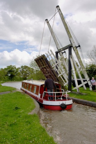 Narrow boat passing through Allmans lift bridge No1Prees branchLlangollen canalnear WhixallShropshir