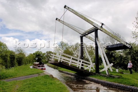 Narrow boat passing through Allmans lift bridge No1Prees branchLlangollen canalnear WhixallShropshir