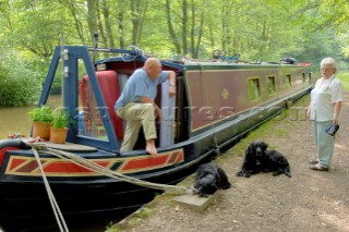 Time for a chat on seecluded moorings on the Llangollen canal near Ellesmere tunnel,Ellesmere,Shropshire,England.July 2006.