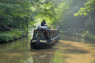 Narrowboat having just exited Ellesmere tunnel,Llangollen canal,Ellesmere,Shropshire,England.July 2006.