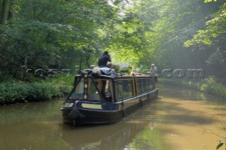 Narrowboat having just exited Ellesmere tunnel,Llangollen canal,Ellesmere,Shropshire,England.July 2006.