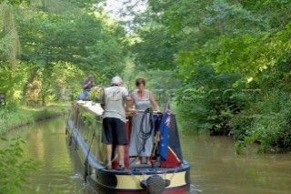 Narrowboat having just exited Ellesmere tunnel,Llangollen canal,Ellesmere,Shropshire,England.July 2006.