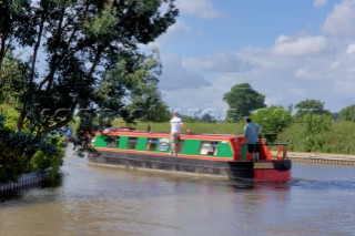 People on narrow boat on the Llangollen canal at Ellesmere,Shropshire,England.