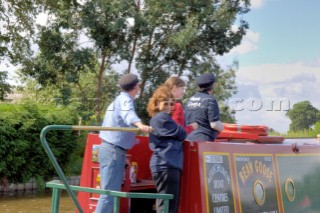 People on narrow boat on the Llangollen canal at Ellesmere,Shropshire,England.