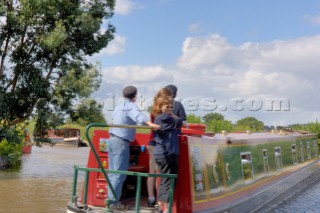 People on narrow boat on the Llangollen canal at Ellesmere,Shropshire,England.