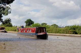 People on narrow boat on the Llangollen canal at Ellesmere,Shropshire,England.