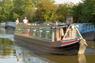 Narrow boat travelling down from  Wheaton Aston lock on the Shropshire Union canal,Staffordshire,England,September 2006.