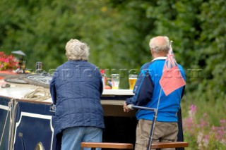 Couple on narrow boat,Llangollen canal,Bettisfield,Clwyd,Wales,August 2006.