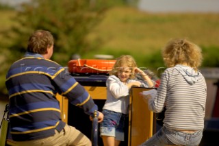 Family on narrow boat on the Llangollen canal at Bettisfield,Clwyd,Wales,August 2006.