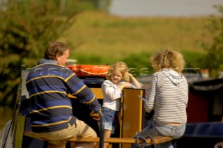 Family on narrow boat on the Llangollen canal at Bettisfield,Clwyd,Wales,August 2006.