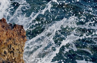 Snapshot of water from wave bouncing off rock