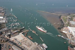 Aerial image of mouth of River Medina at Cowes Isle of Wight showing the marinas in West Cowes and the Red Funnel ferry terminal in East Cowes