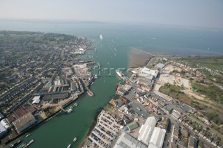 Aerial image of mouth of River Medina at Cowes Isle of Wight showing the marinas in West Cowes and the Red Funnel ferry terminal in East Cowes