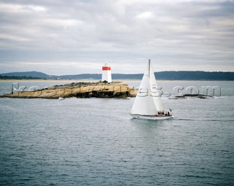 Love and War passing the Iron Pot approaching Tasmania and the finish if the Rolex Sydney Hobart Rac