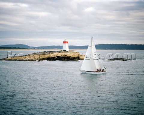 Love and War passing the Iron Pot approaching Tasmania and the finish if the Rolex Sydney Hobart Rac