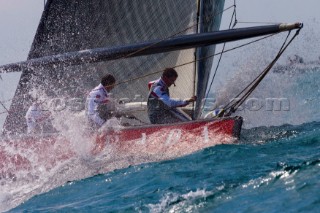 Foredeck crew prepare for a spinnaker hoist