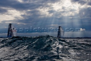 Two yacht sailing in bad weather