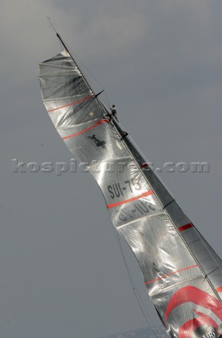 Bow man at the top of Alighis mast struggling to fix the broken mainsail halyard