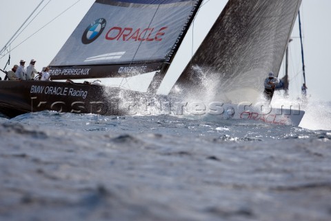 BMW Oracle approaching the windward mark and preparing for a hoist