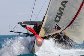 Emirates Team New Zealand NZL84 bowman Stu Bettany prepares the spinnaker at the first top mark rounding of race six of the Louis Vuitton Act 13. 7/4/2007