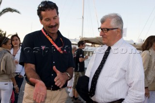 VALENCIA, SPAIN - May 14th: Americas Cup yachtsman Paul Cayard (USA left) who is presently representing Desafio Espanol, discusses tactics to Patrizio Bertelli, the owner of the Luna Rossa Prada Challenge, at the exclusive Tuiga Party during the Louis Vuitton Cup Semi Finals.