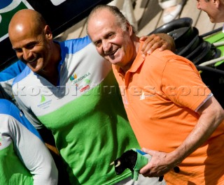 VALENCIA, SPAIN - May 14th:  HRH King Juan©Carlos of Spain (orange shirt) racing as 18th man onboard Desafio Espanol during the first semi final match of the Louis Vuitton Cup on May 14th 2007.