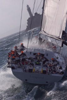 The super maxi Rambler racing around the Fastnet Rock Lighthouse chased by ICAP Leopard during the Rolex Fastnet Race 2007 (Editorial Use only)