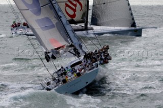 COWES, ENGLAND - August 13th: Alfa Romeo owned by Neville Creighton (NZ) leads ICAP Leopard 3 owned by Mike Slade (UK) and the fleet of nearly 300 racing yachts leaving Cowes on the Isle of Wight to begin the 605 mile Rolex Fastnet Race on August 13th 2007. The yachts race to the Fastnet Rock off southern Ireland and back to the finish in Plymouth, England.