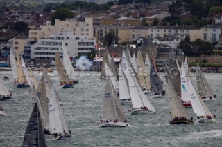 COWES, ENGLAND - August 13th: The fleet of nearly 300 racing yachts leaves Cowes on the Isle of Wight to begin the 605 mile Rolex Fastnet Race on August 13th 2007. The yachts race to the Fastnet Rock off southern Ireland and back to the finish in Plymouth, England.