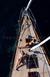 Topless woman on a boat