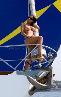 Topless woman on a boat