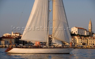 Glamorous female lifestyle model onboard a sailing yacht in the Mediterranean