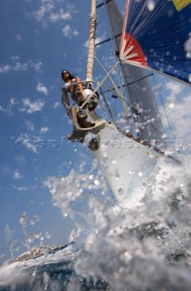 Glamorous female lifestyle model onboard a sailing yacht in the Mediterranean