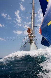 Glamorous female lifestyle model onboard a sailing yacht in the Mediterranean