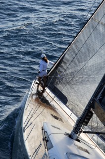 Glamorous female lifestyle model onboard a sailing yacht in the Mediterranean