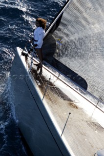 Glamorous female lifestyle model onboard a sailing yacht in the Mediterranean