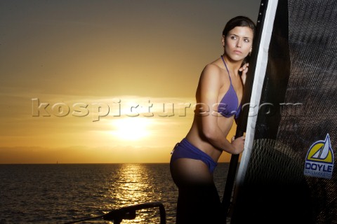 Glamorous female lifestyle model onboard a sailing yacht in the Mediterranean