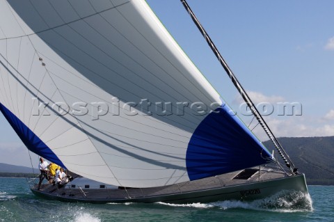 Glamorous female lifestyle model onboard a sailing yacht in the Mediterranean