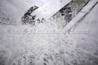 Above and below the water surface as a yacht rounds the windward mark on Day 5 of the Rolex Commodores Cup 2008 in the Solent, UK.