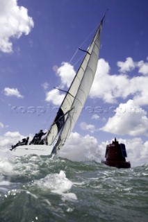 Above and below the water surface as a yacht rounds the windward mark on Day 5 of the Rolex Commodores Cup 2008 in the Solent, UK.