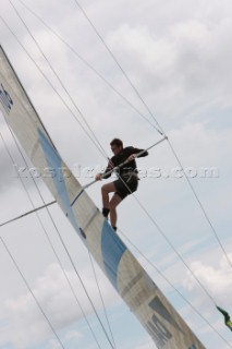 COWES, UK - July 4th: The bowman climbs the mast on the Dutch yacht Daikin on Day 5 of the Rolex Commodores Cup in Cowes, Isle of Wight, the British Team GBR Red extend to a 10 point lead over the French Blue Team. The Rolex Commodores Cup is a biannual team event for big racing yachts representing countries around the world.