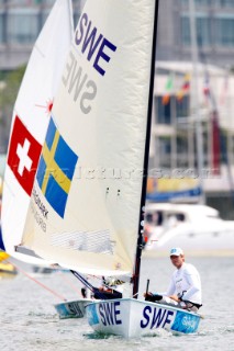 Qingdao, China, 20080807: 2008 OLYMPICS - Practice Race at Olympic Sailing Regatta before the real deal begins on Saturday. Daniel Birgmark - Finn Class.  (No sale to Denmark)